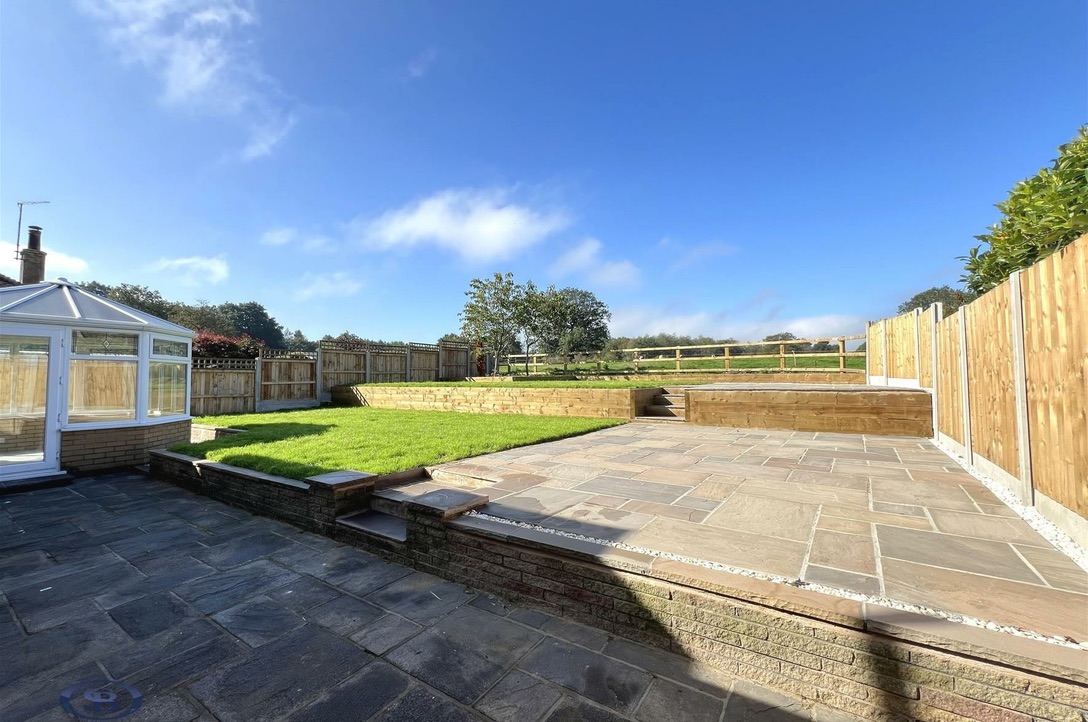 Terraced patio and lawn from the conservatory