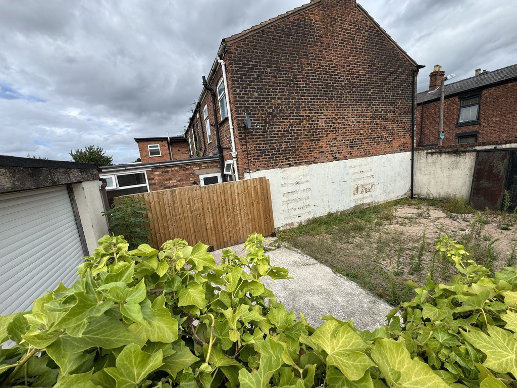 Rear land cleared for resident parking