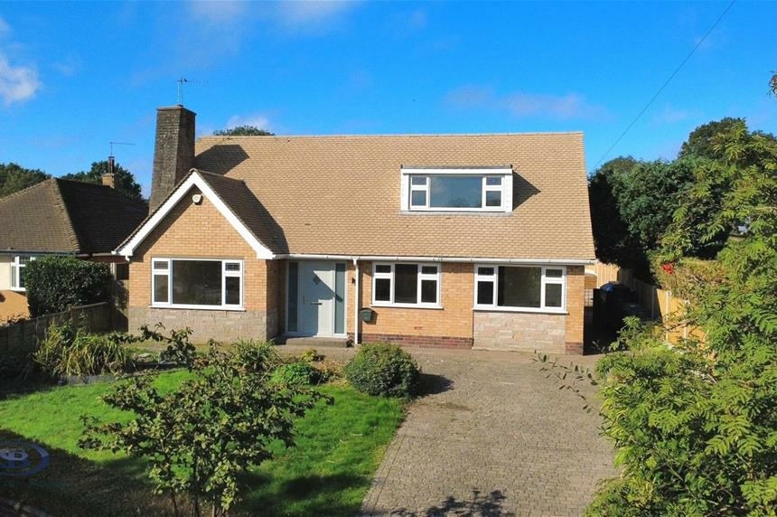 Front elevation with new dormer and driveway