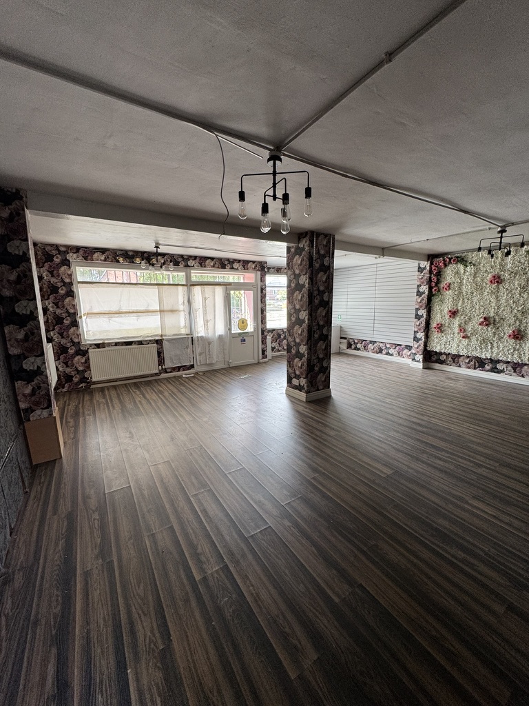 Empty commercial unit interior with wooden flooring