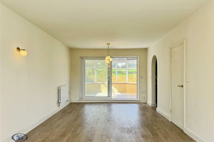 Lounge with doors out to the conservatory