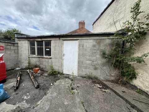 Garage and outbuilding to the rear